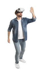 Photo of Emotional man using virtual reality headset on white background