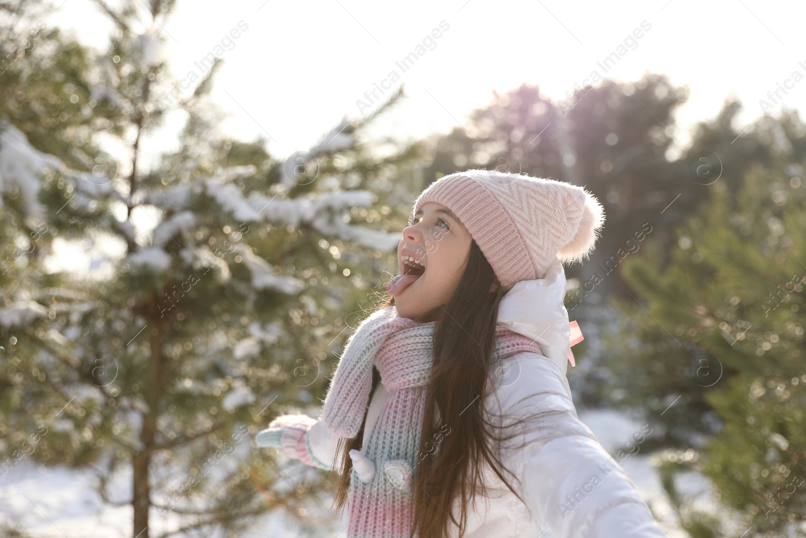 Photo of Cute little girl outdoors on winter day. Christmas vacation