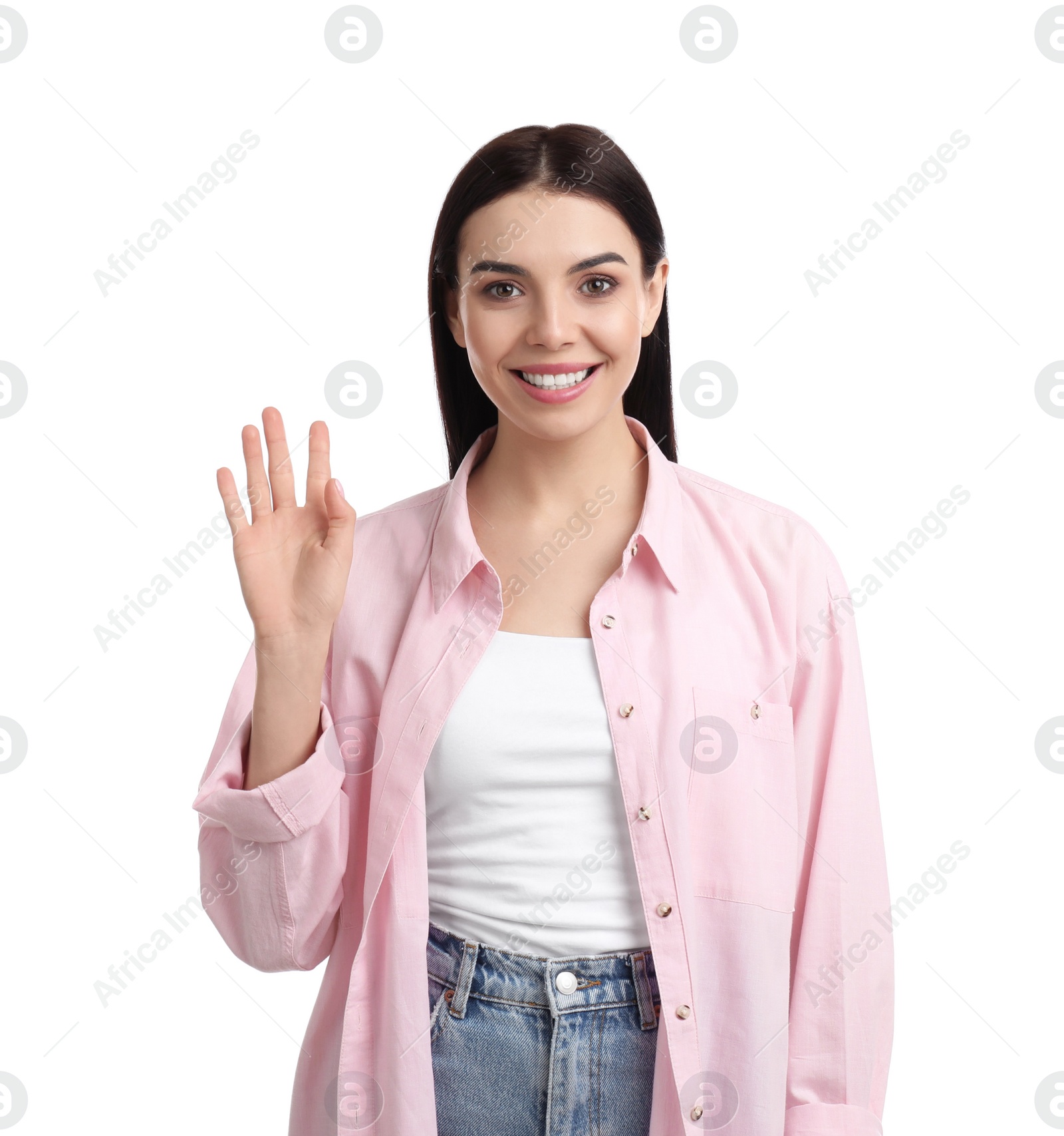 Photo of Attractive young woman showing hello gesture on white background