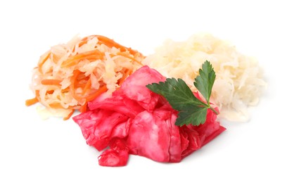 Photo of Delicious sauerkraut prepared according to different recipes with parsley on white background