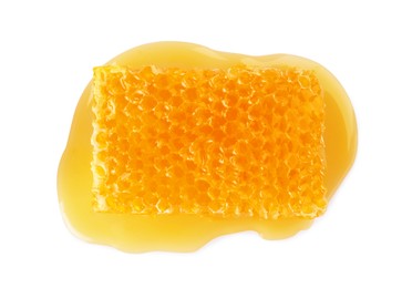 Photo of Natural honeycomb with tasty honey isolated on white, top view