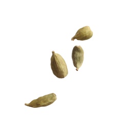 Dry cardamon seeds on white background. Mulled wine ingredient