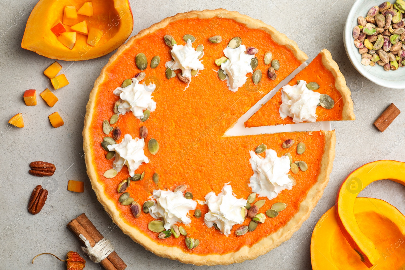 Photo of Delicious homemade pumpkin pie on light table, flat lay