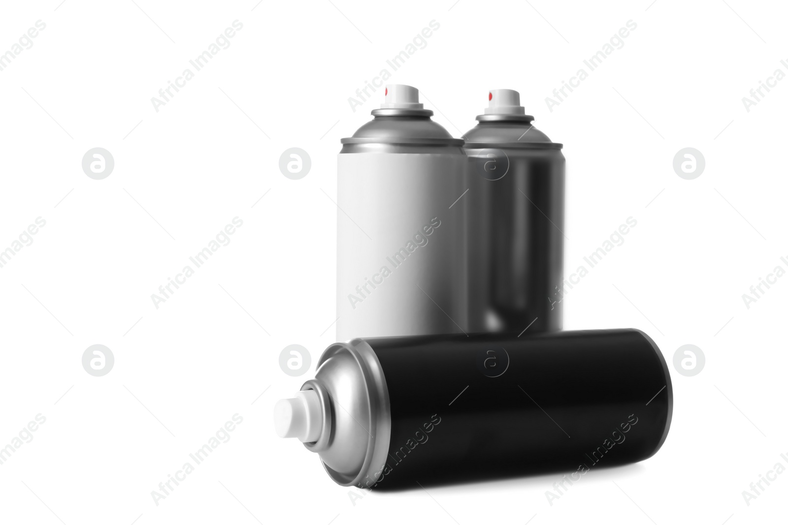 Photo of Cans of different spray paints on white background