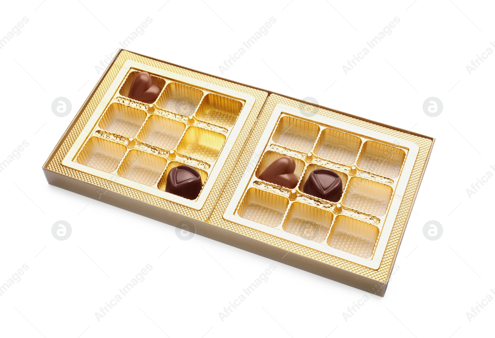 Photo of Partially empty box of chocolate candies isolated on white