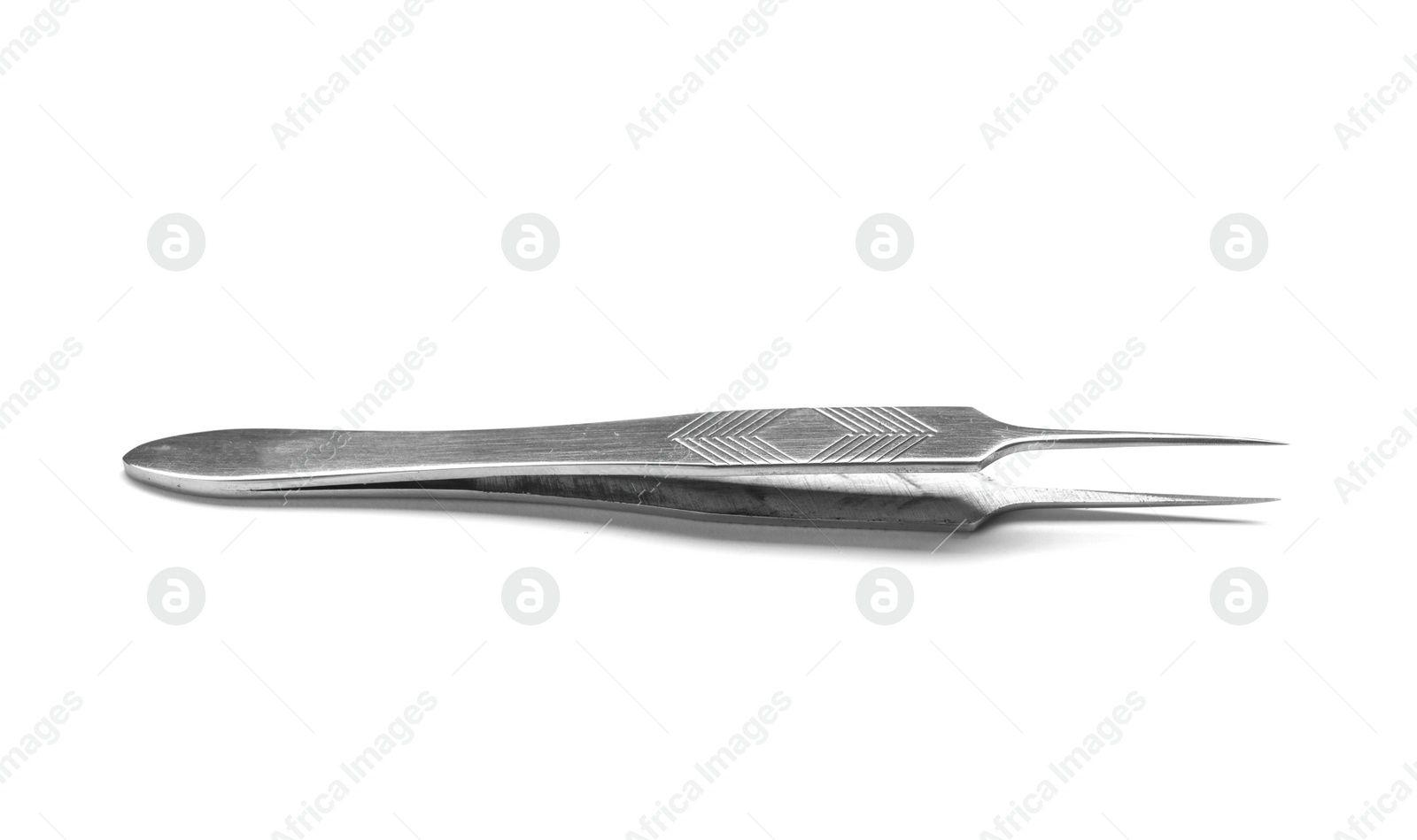 Photo of Metallic tweezers on white background. Eyelash extension tool