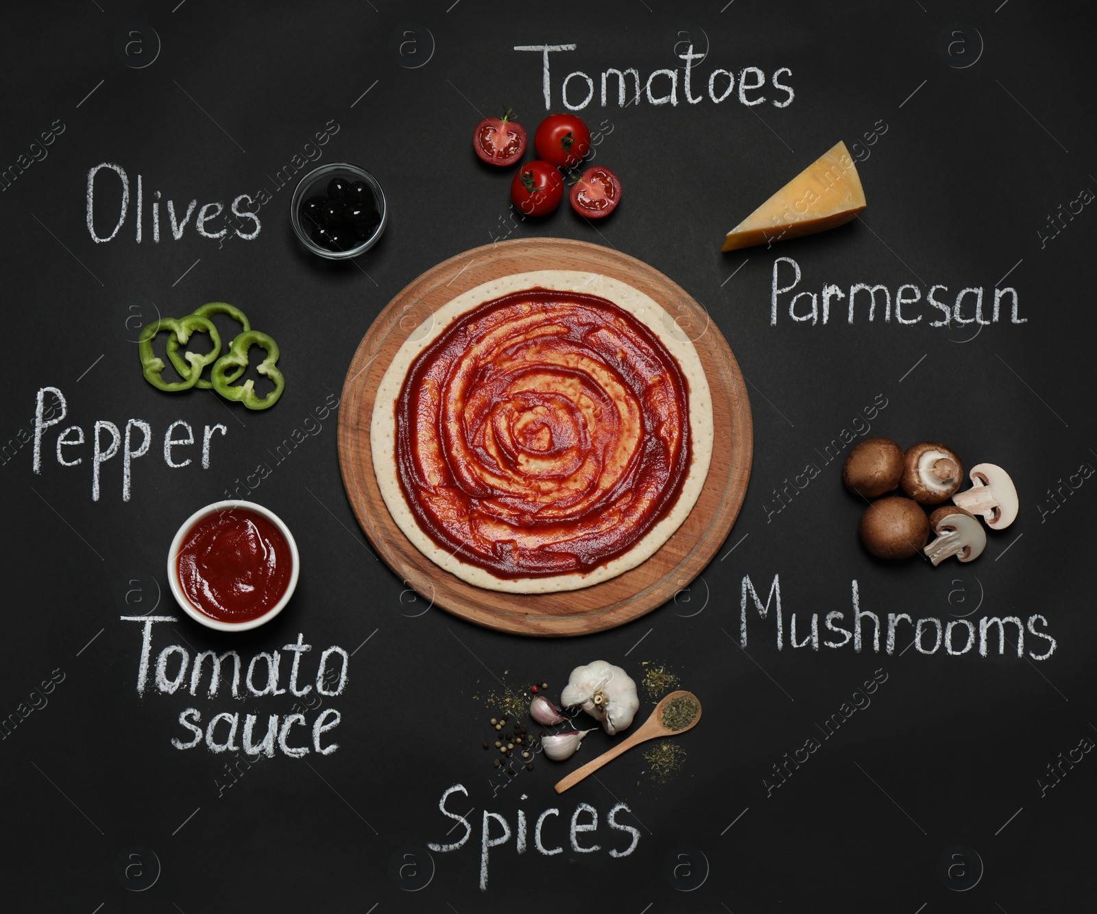 Photo of Pizza crust, ingredients and chalk written product's names on black background, flat lay