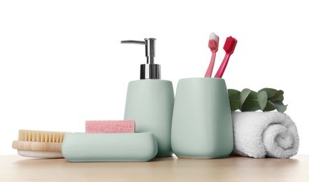 Photo of Bath accessories. Different personal care products and eucalyptus branch on wooden table against white background