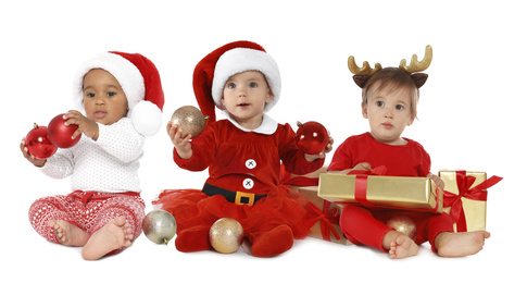 Image of Collage with photos of cute babies with Christmas decorations on white background. Banner design