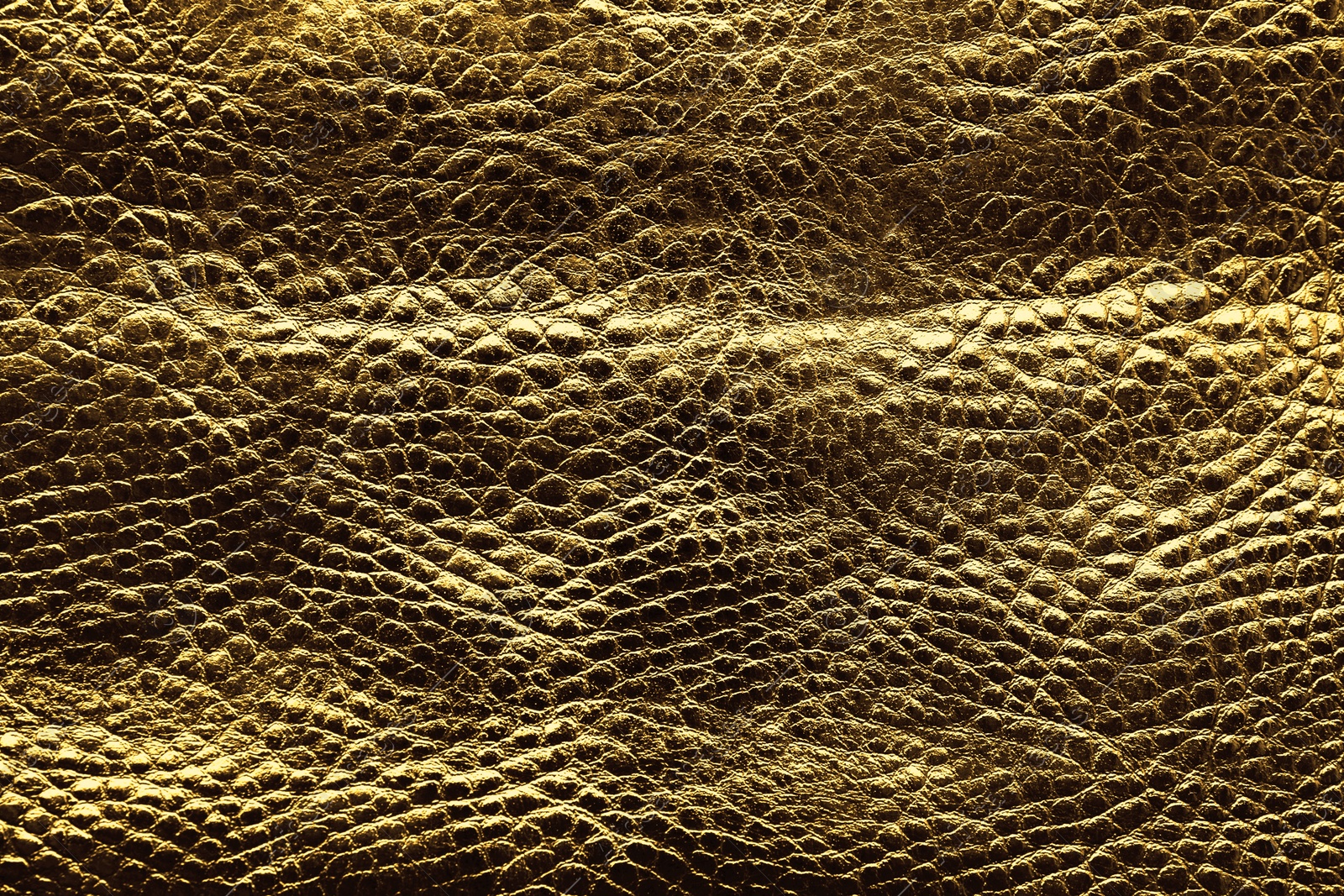 Image of Golden textured surface as background, closeup view