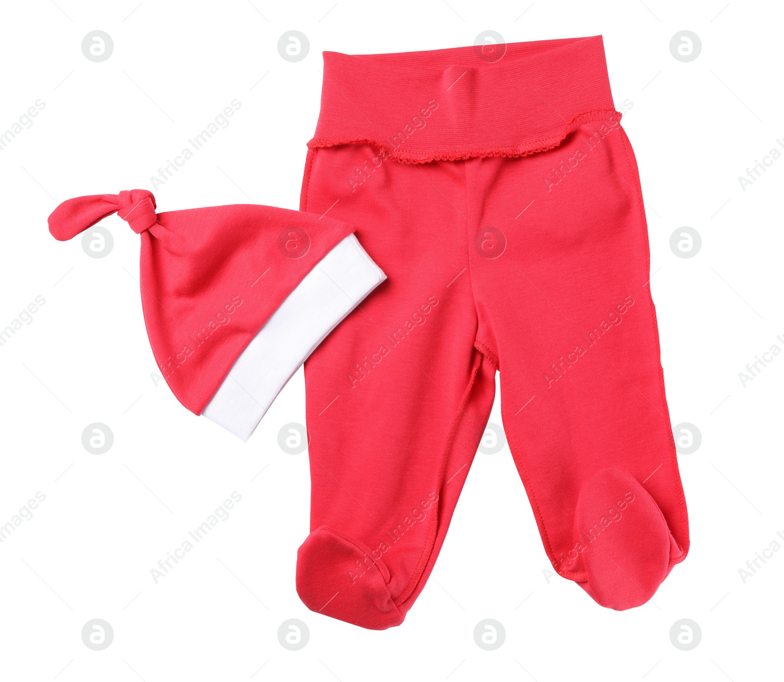 Photo of Red footed pants and hat on white background, top view. Christmas baby clothes