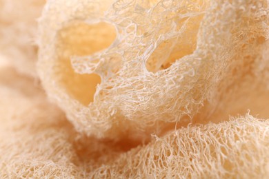 Natural loofah sponge as background, closeup view