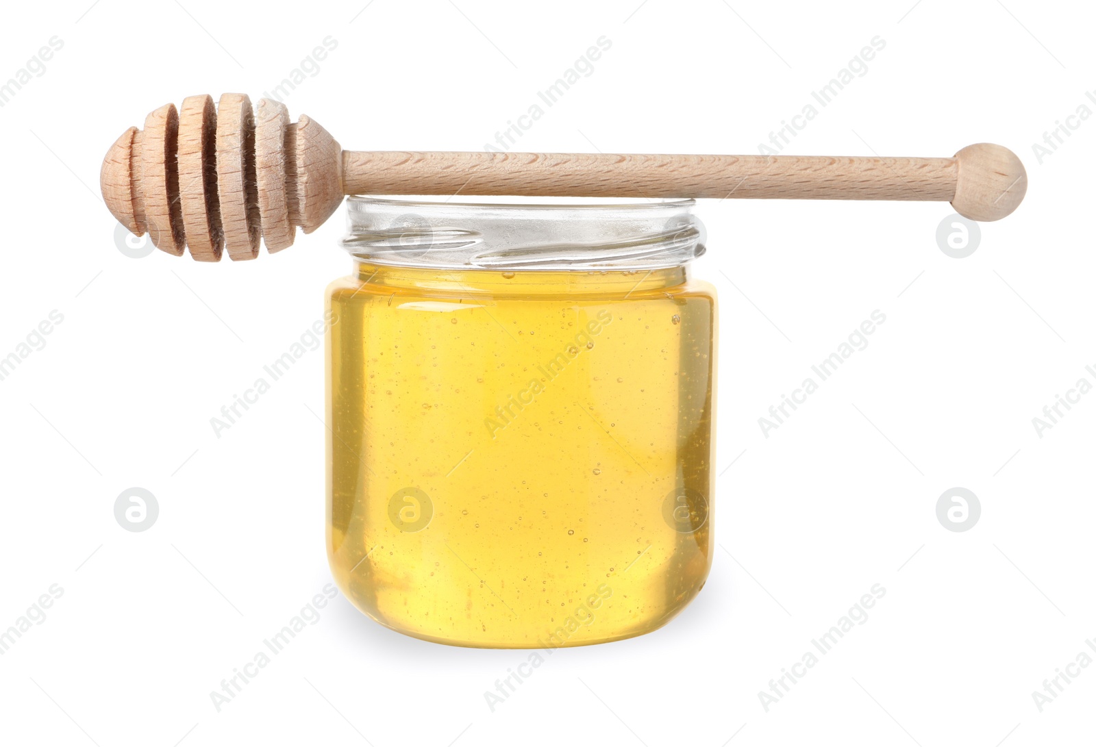 Photo of Tasty honey in glass jar and dipper isolated on white