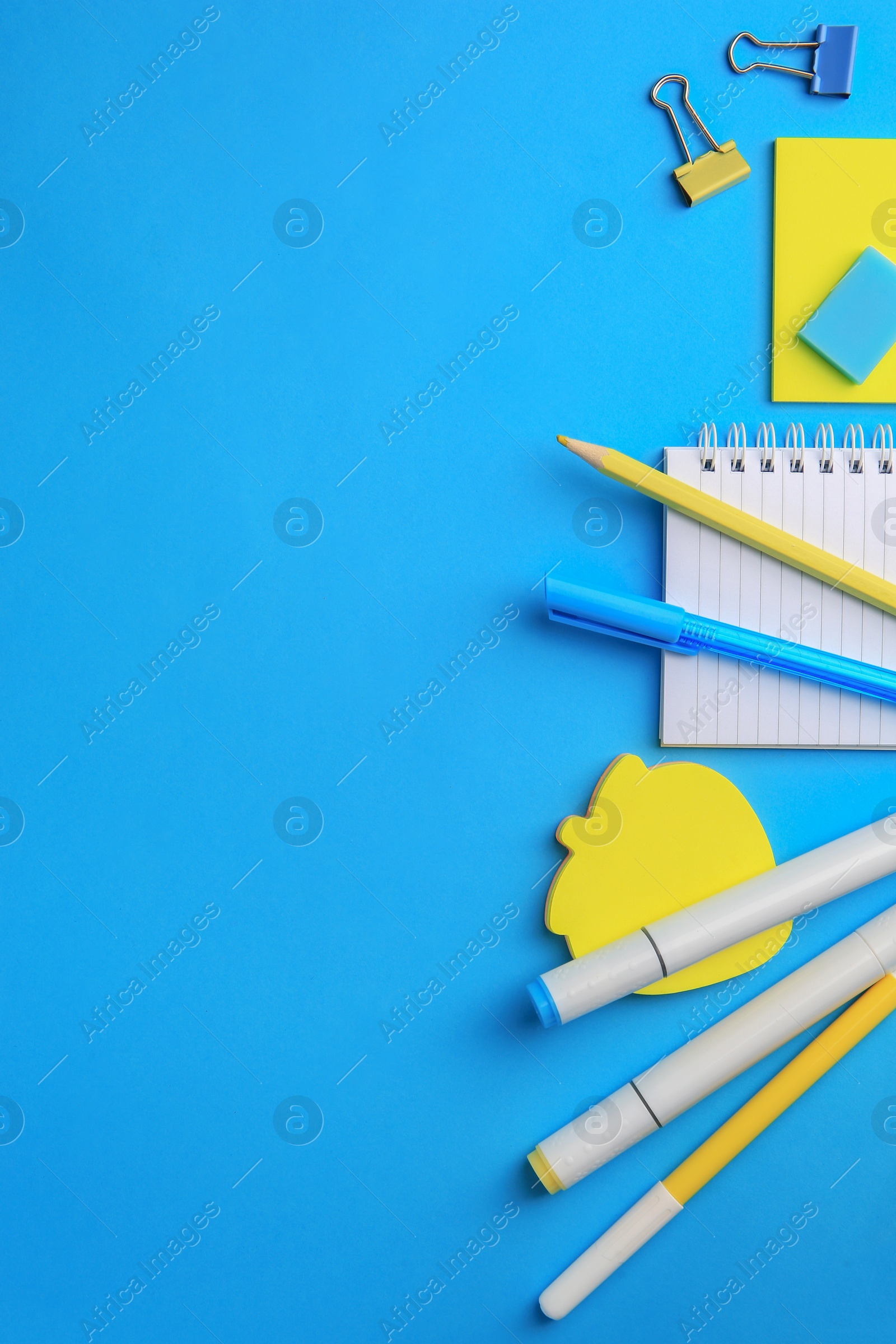 Photo of Flat lay composition with different school stationery on light blue background, space for text. Back to school