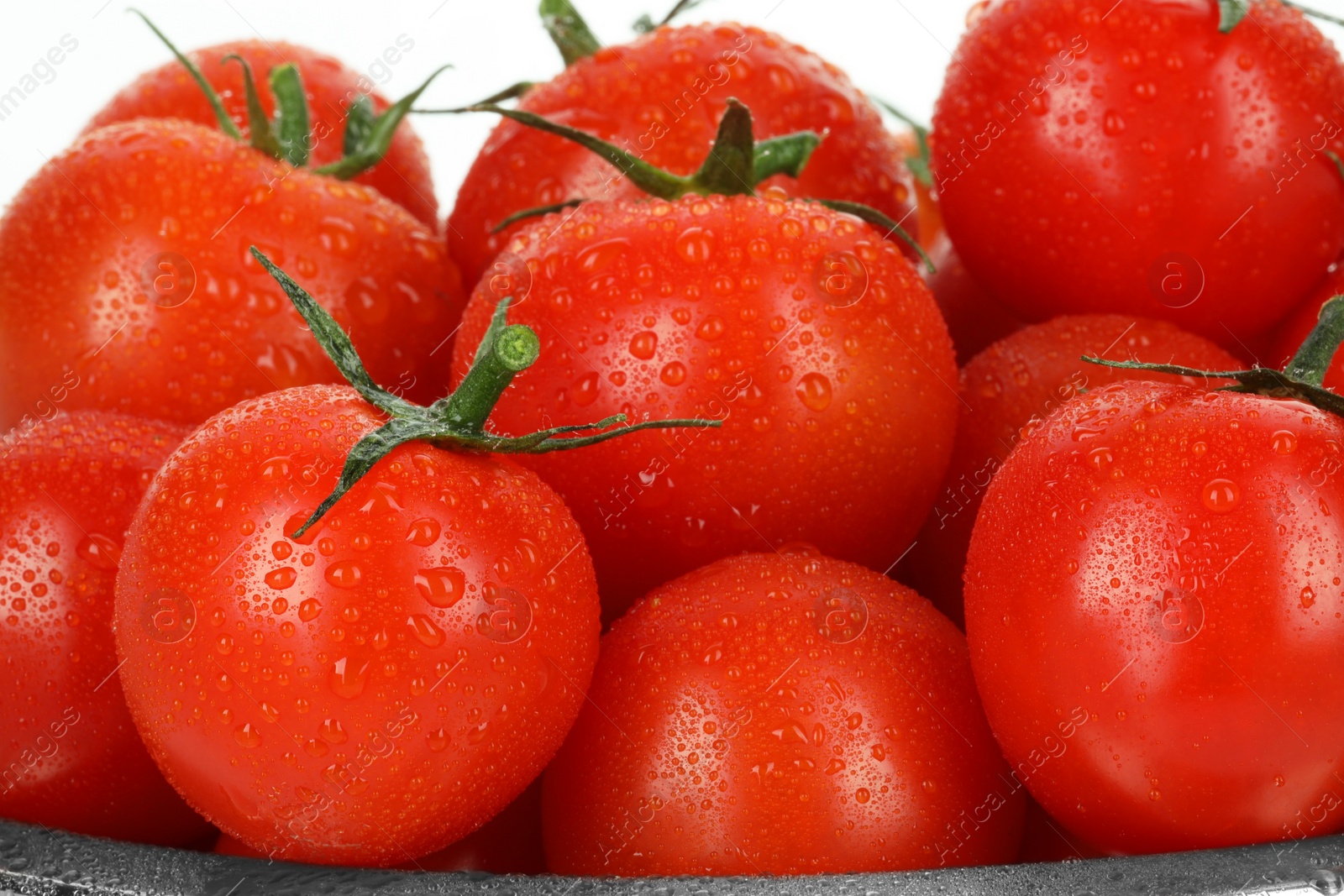 Photo of Many fresh ripe cherry tomatoes with water drops on white background, closeup
