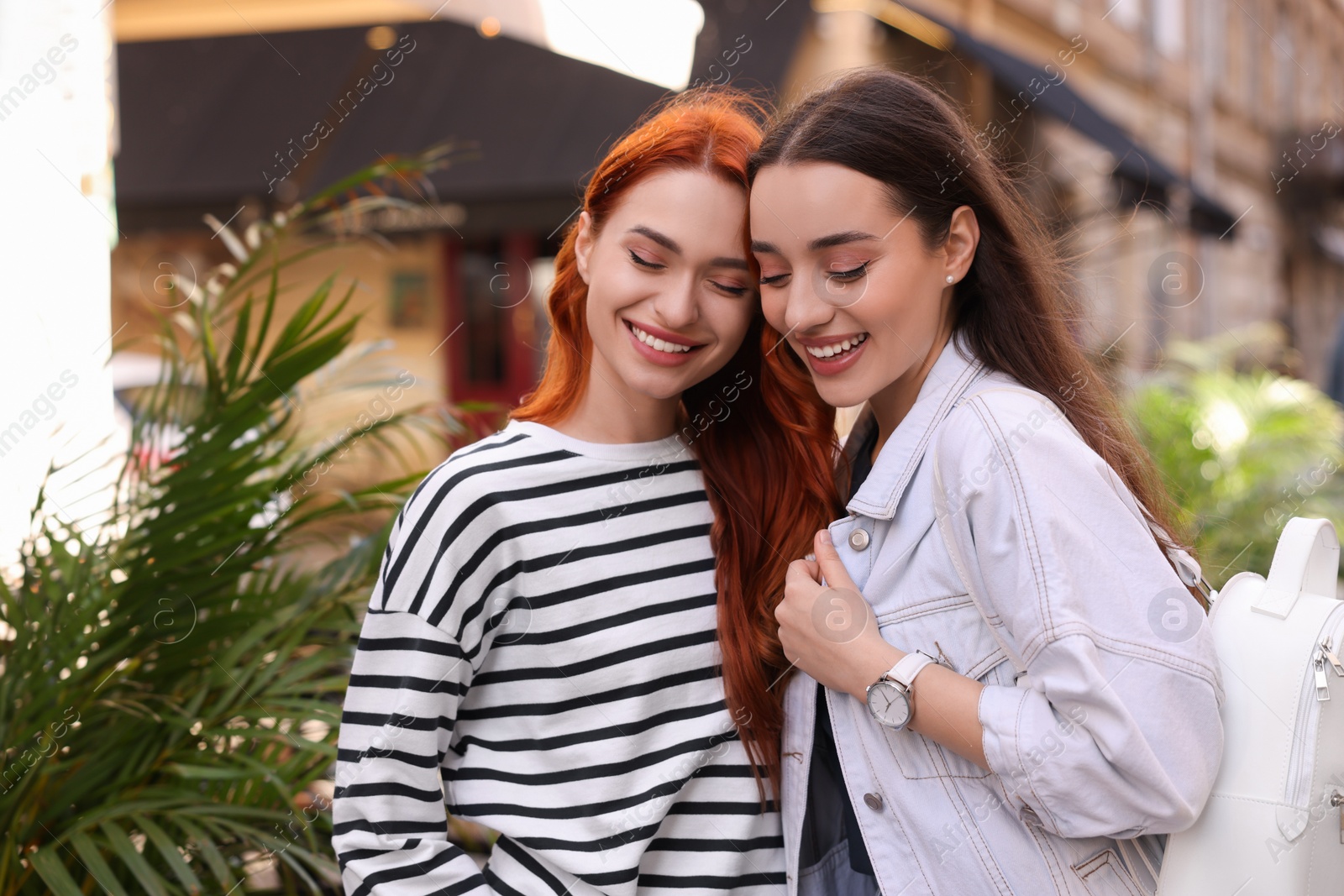 Photo of Portrait of happy friends spending time together outdoors