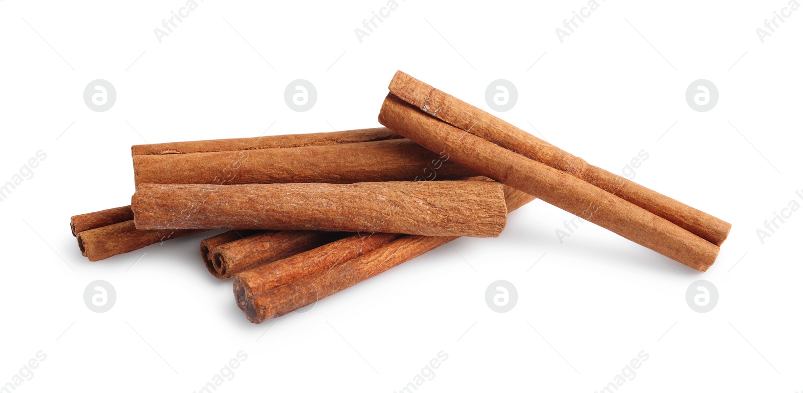 Photo of Pile of aromatic cinnamon sticks isolated on white