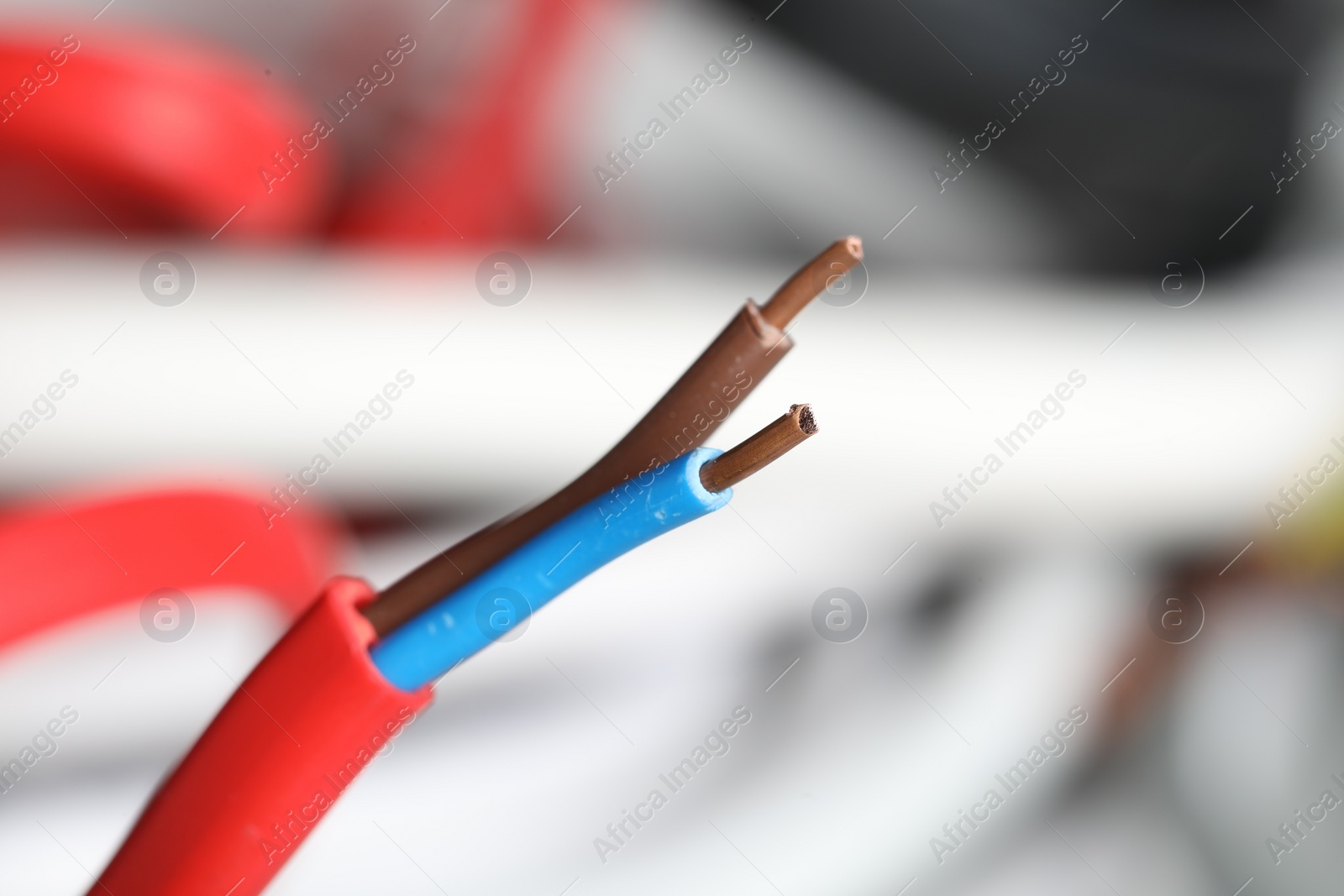 Photo of Colorful electrical wire on blurred background, closeup