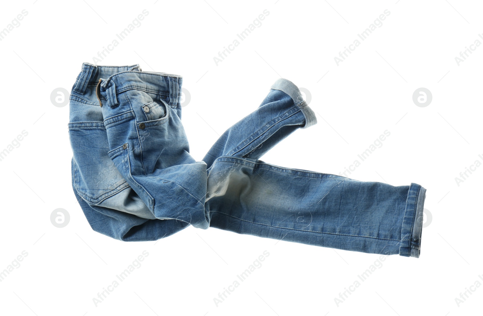 Photo of Rumpled jeans isolated on white. Messy clothes
