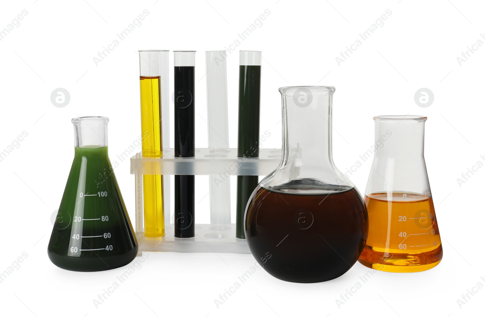 Photo of Laboratory glassware with different types of crude oil isolated on white