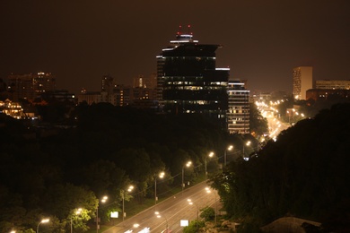 Night road with illumination in modern city