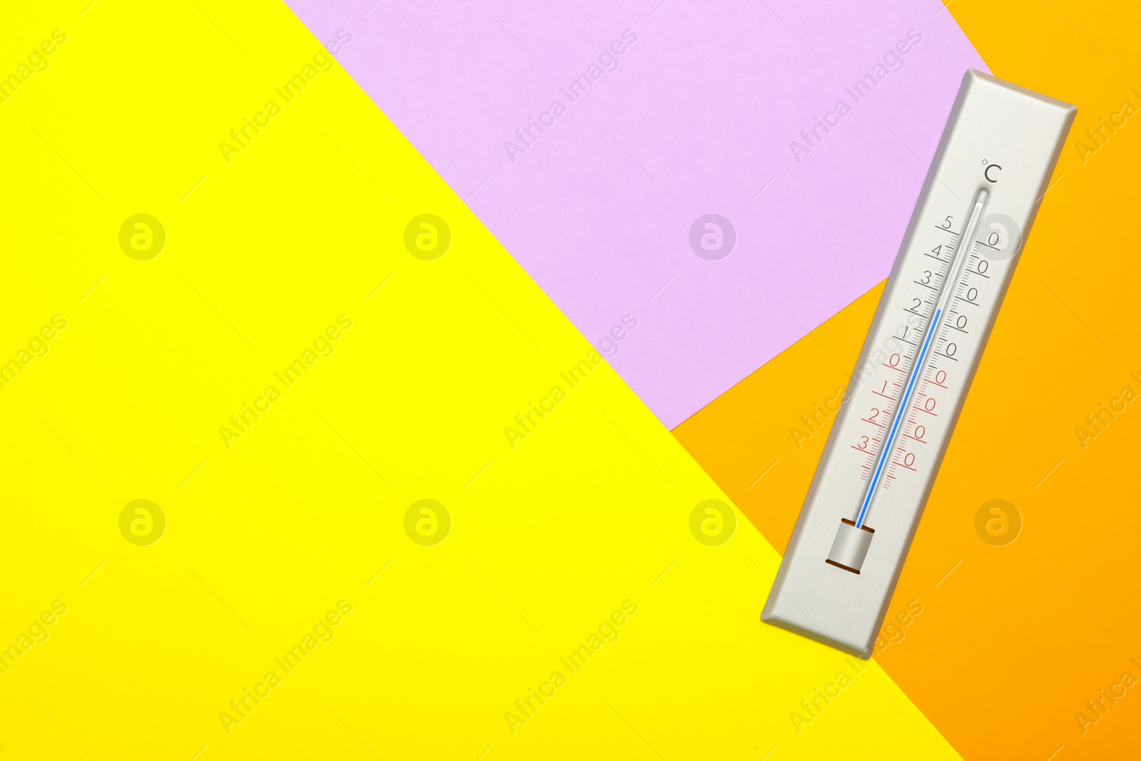 Photo of Weather thermometer on color background, top view. Space for text