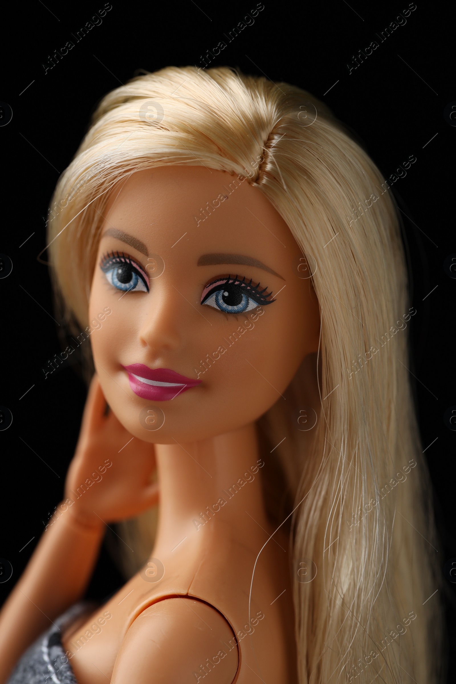 Photo of Mykolaiv, Ukraine - September 1, 2023: Beautiful Barbie doll on black background