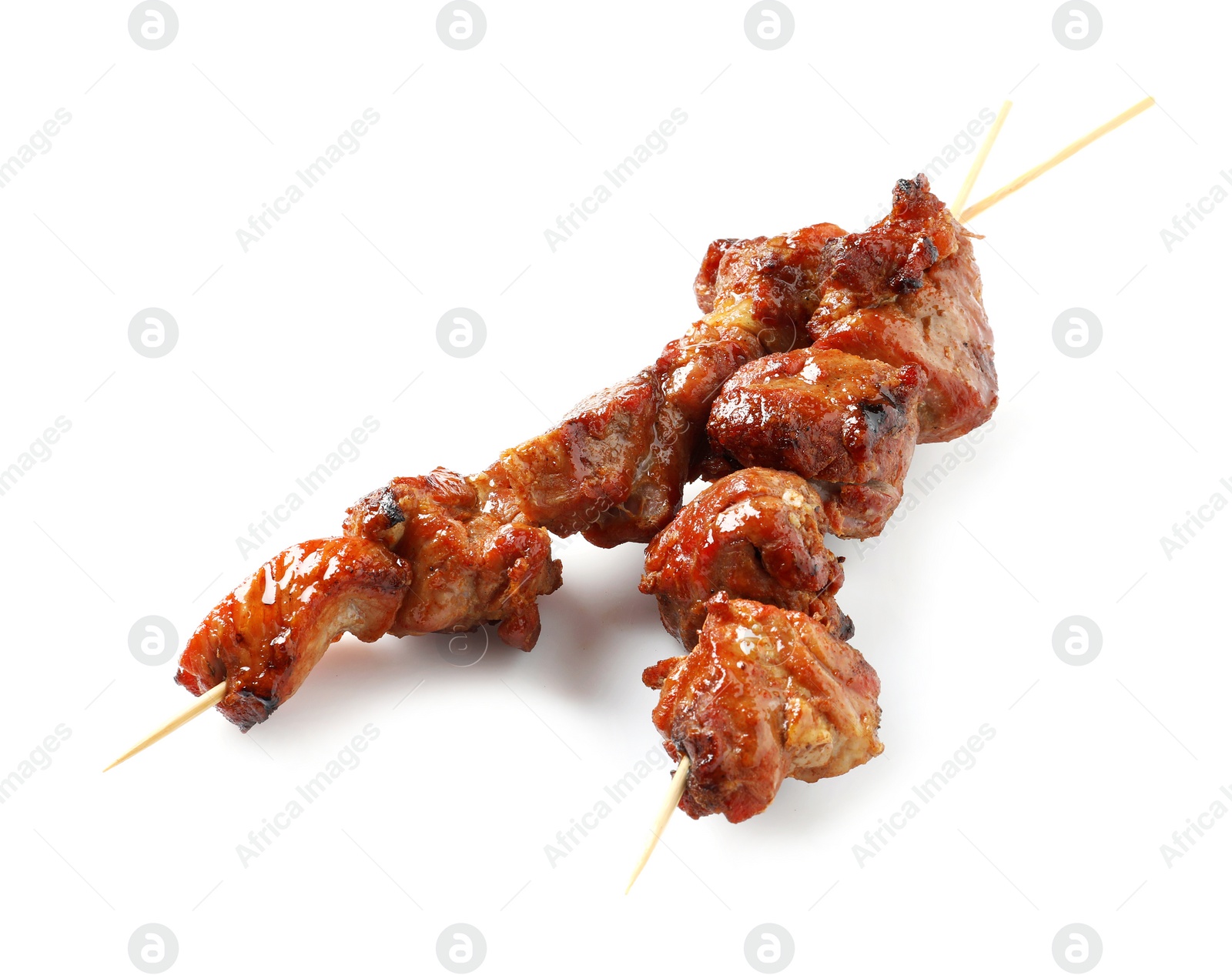 Photo of Skewers with delicious barbecued meat on white background