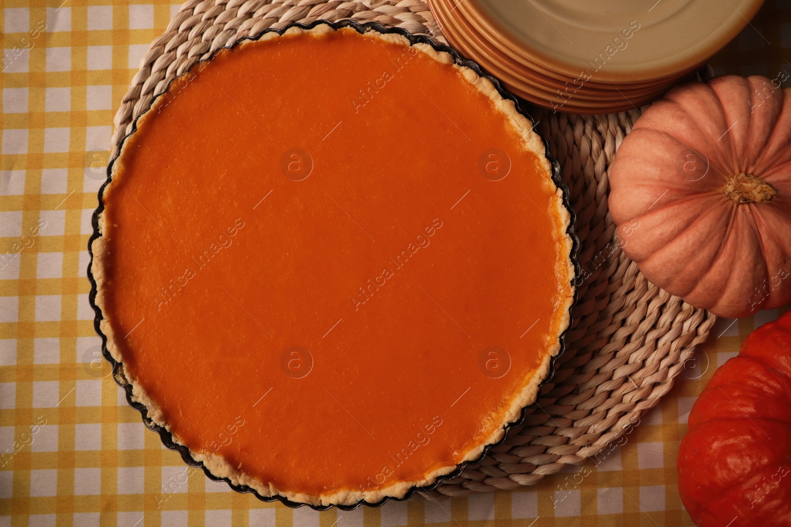 Photo of Delicious homemade pie and pumpkins on table, flat lay