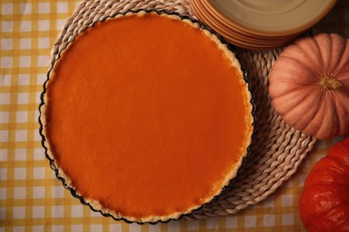 Photo of Delicious homemade pie and pumpkins on table, flat lay