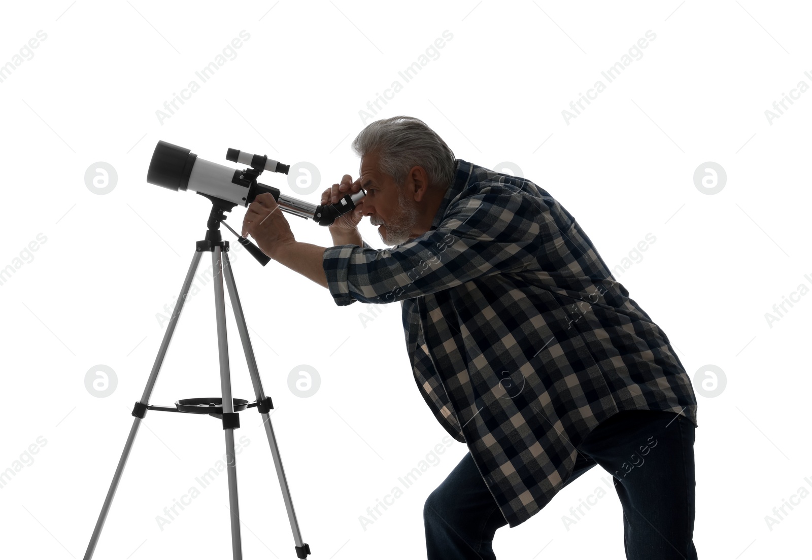 Photo of Senior astronomer looking at stars through telescope on white background