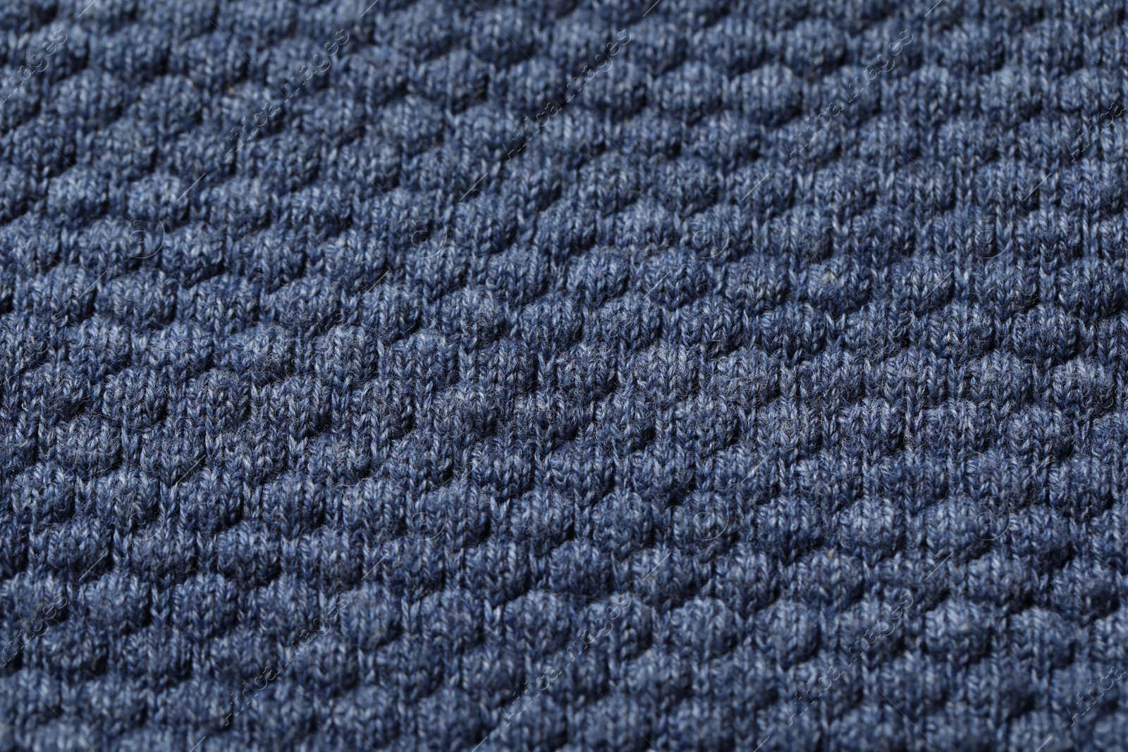 Photo of Texture of soft blue fabric as background, top view