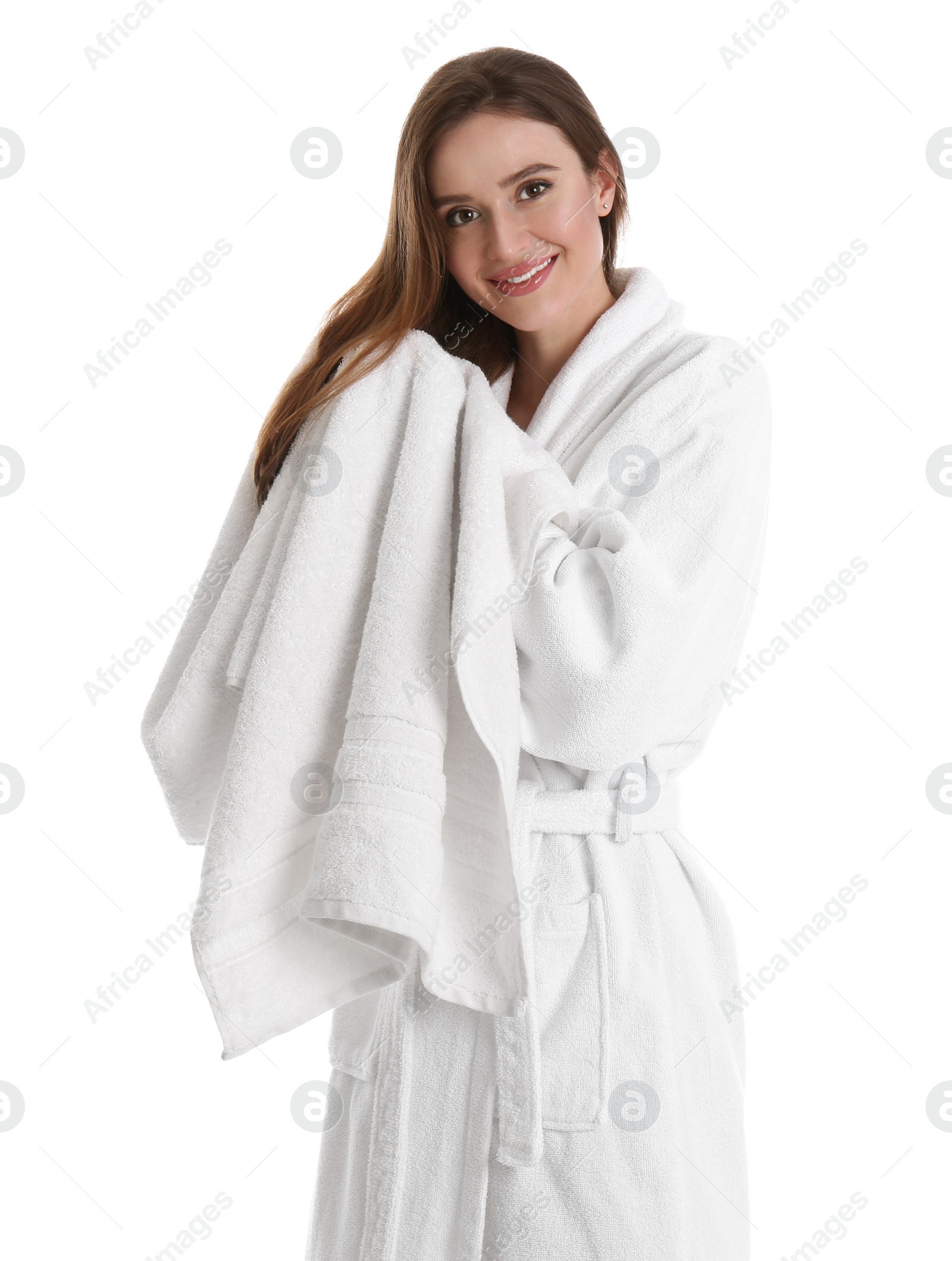 Photo of Young woman in bathrobe drying hair with towel on white background