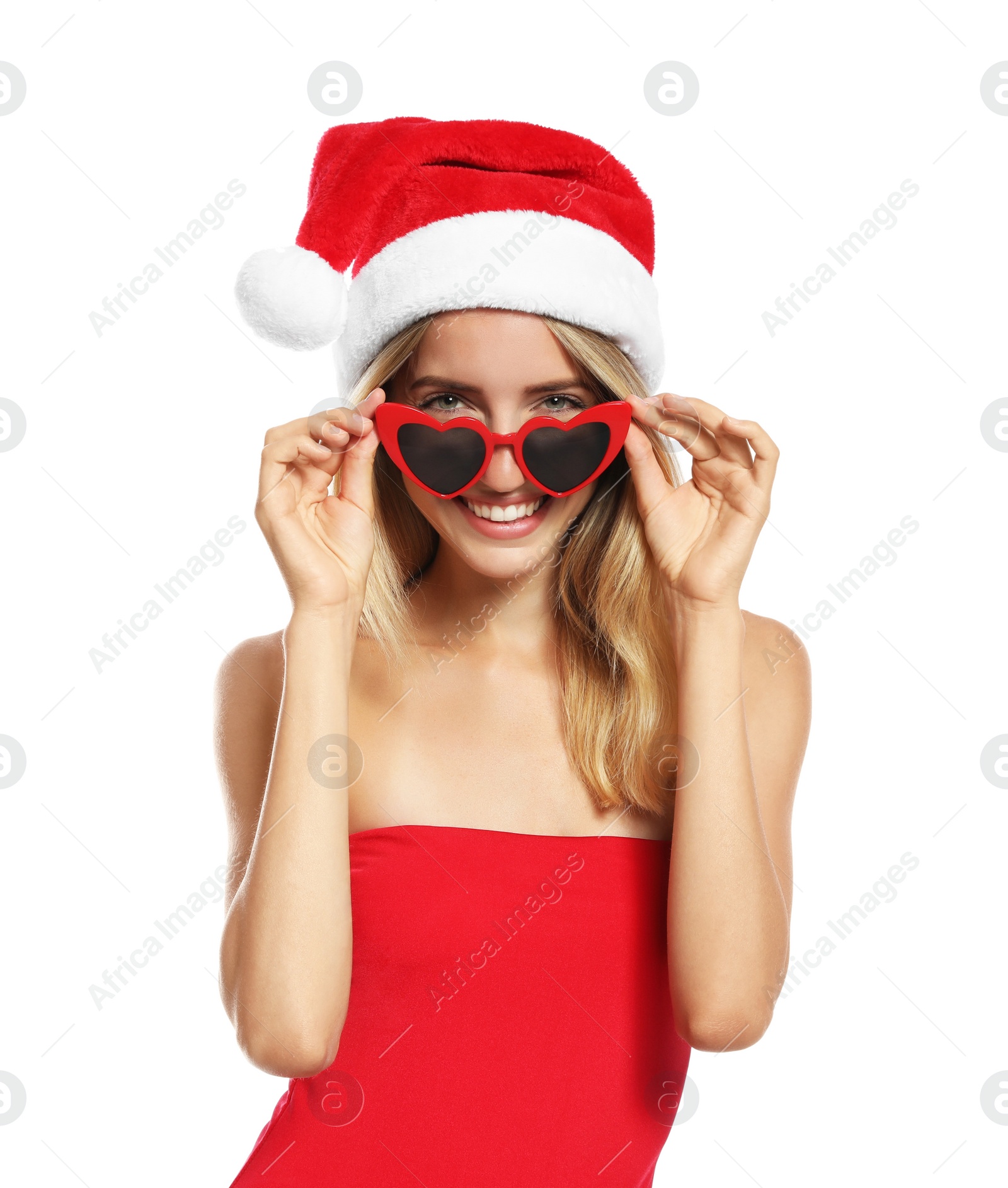 Photo of Young woman wearing Santa Claus hat on white background. Christmas vacation