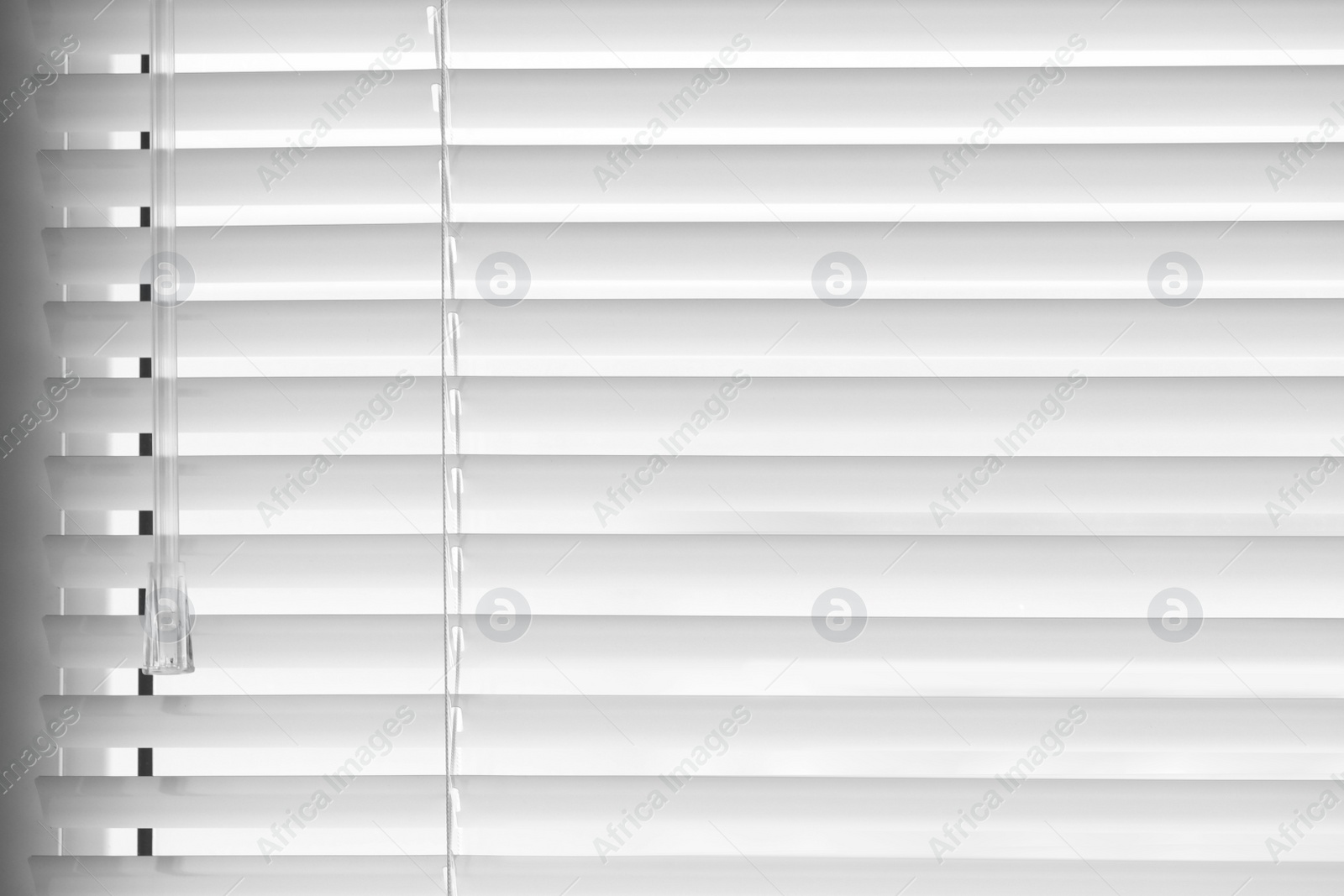 Photo of Closeup view of stylish horizontal window blinds