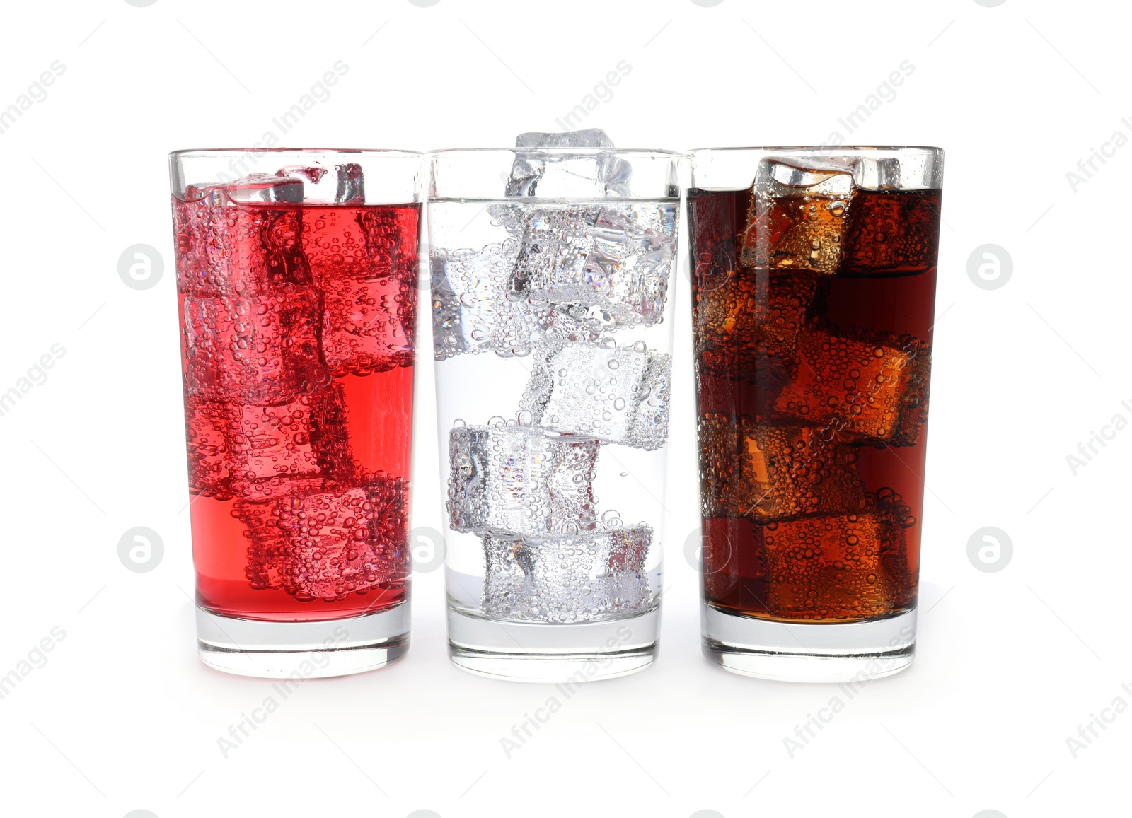 Photo of Glasses of different refreshing soda water with ice cubes isolated on white