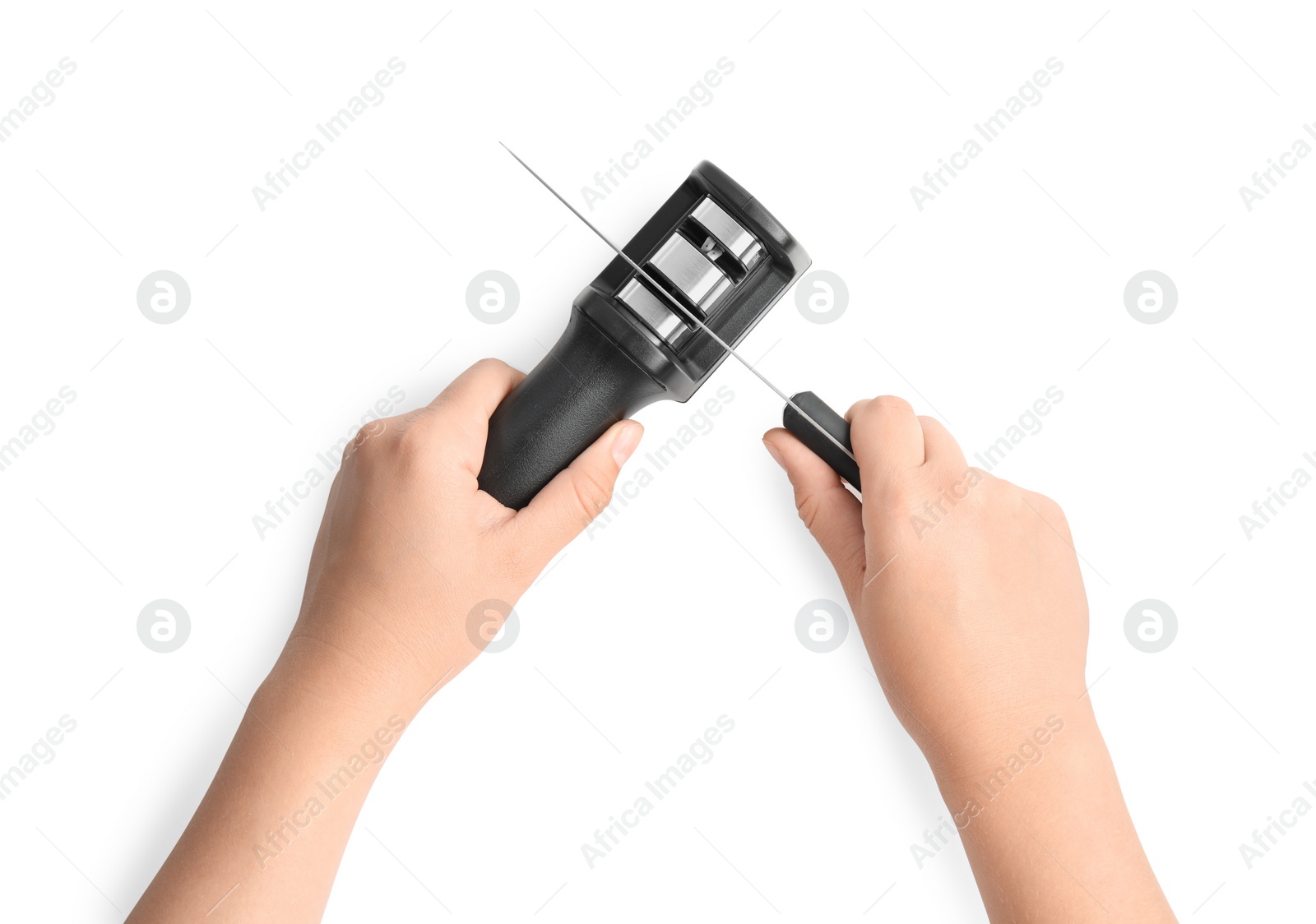 Photo of Woman sharpening knife on white background, top view