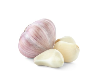 Fresh garlic bulb and cloves on white background