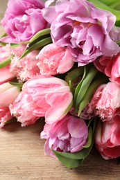 Beautiful bouquet of colorful tulip flowers on table, closeup