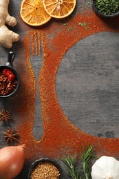 Photo of Flat lay composition with different spices, silhouettes of fork and plate on grey table