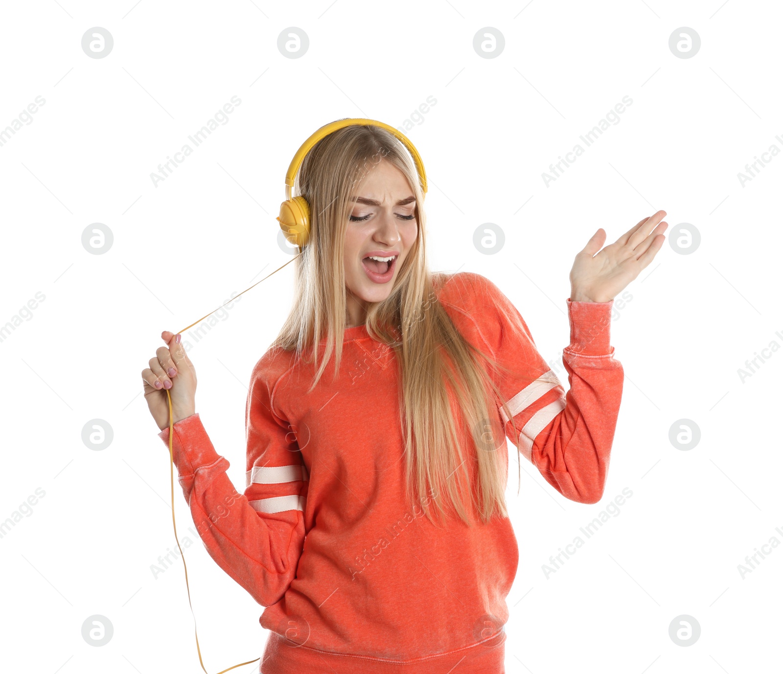 Photo of Beautiful young woman listening to music with headphones on white background