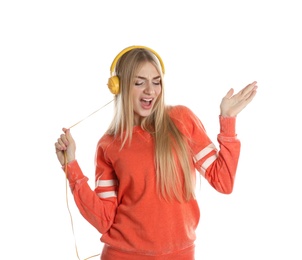 Photo of Beautiful young woman listening to music with headphones on white background