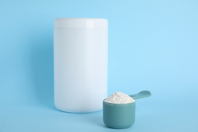 Photo of Amino acid powder on light blue background