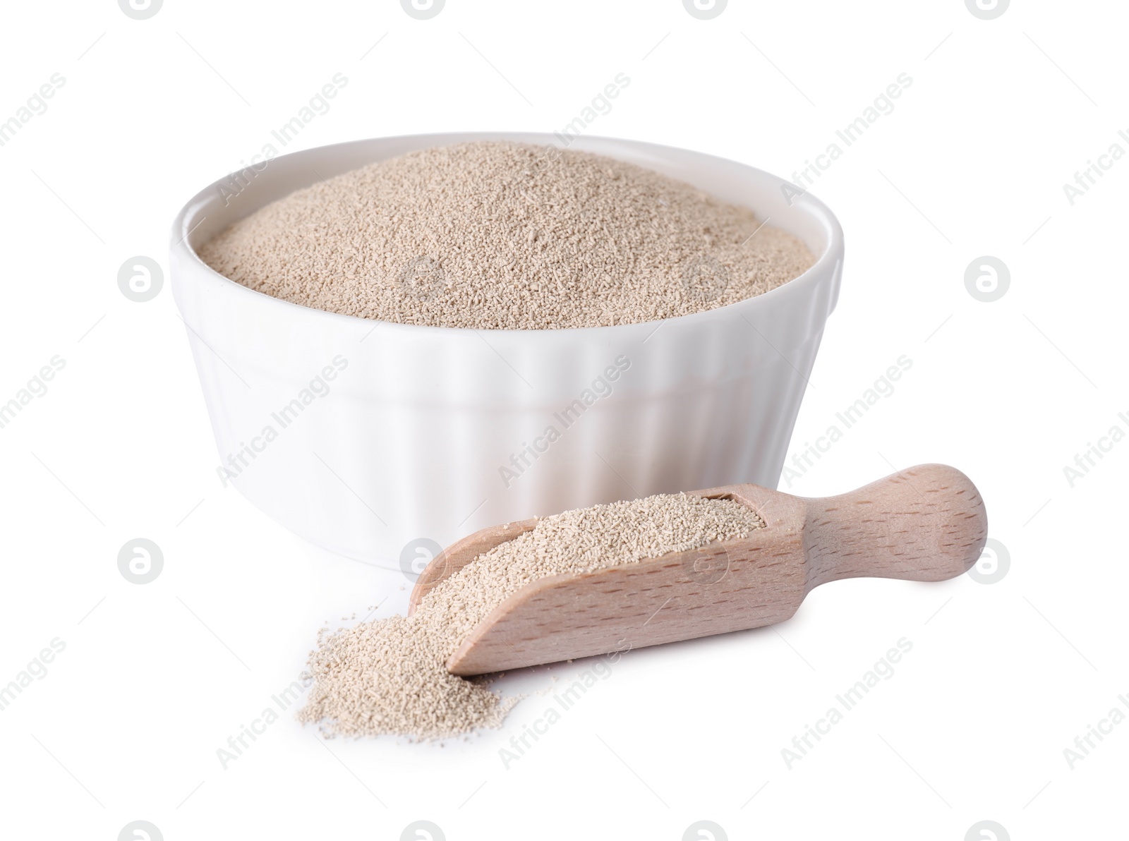 Photo of Bowl and scoop with active dry yeast isolated on white