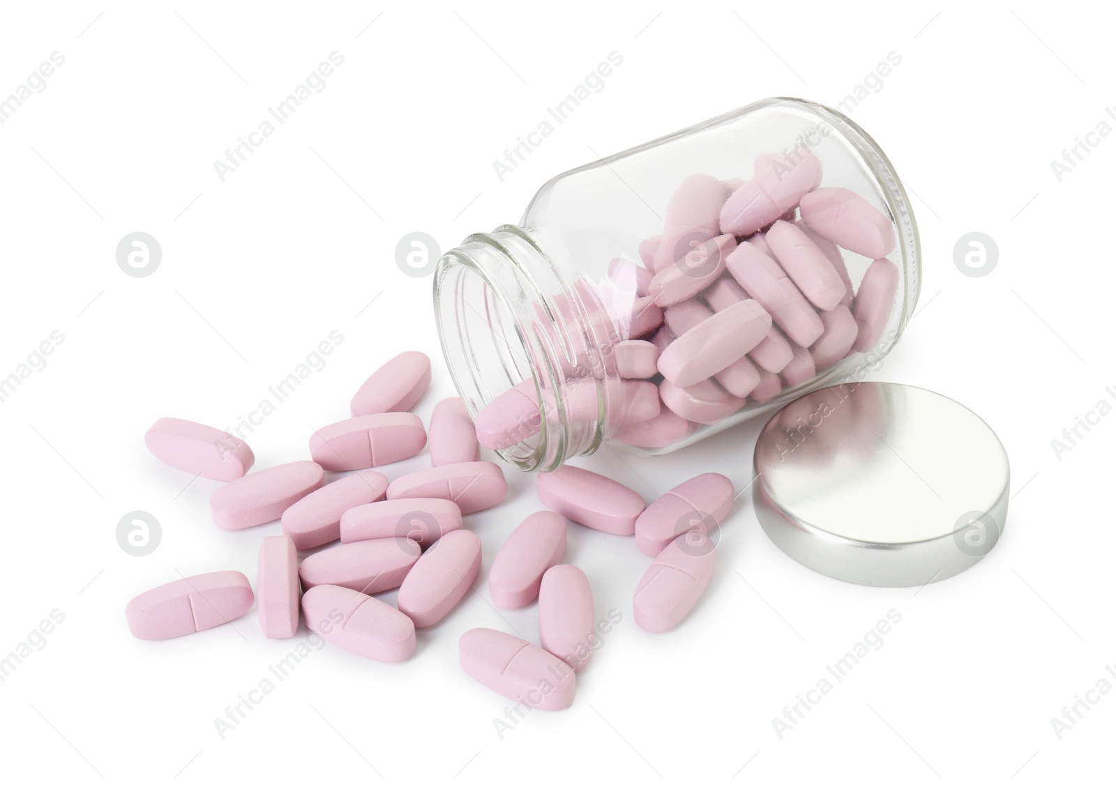 Photo of Scattered vitamin pills and bottle isolated on white