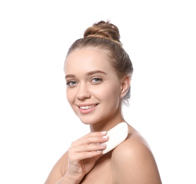 Young woman with soap bar on white background