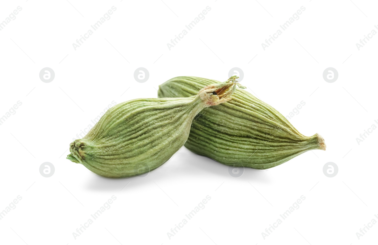 Photo of Dry green cardamom pods on white background, closeup