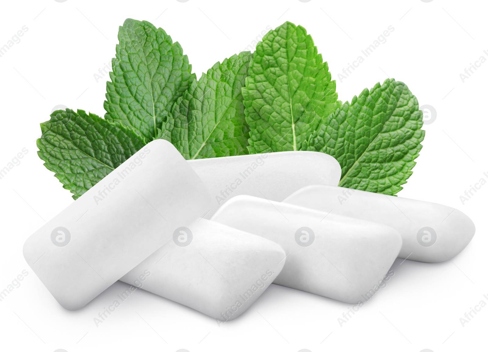 Image of Menthol chewing gum pillows and mint leaves on white background