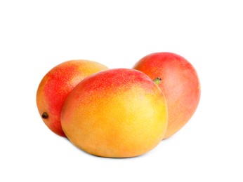 Delicious ripe juicy mangoes on white background