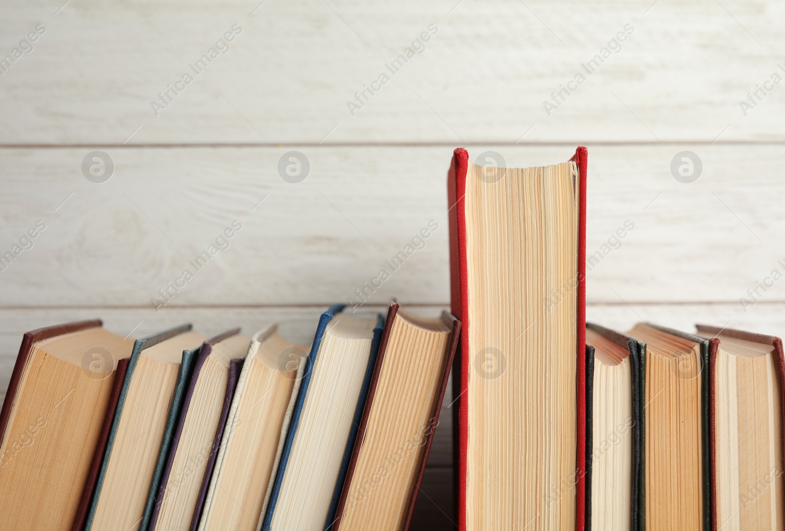 Photo of Collection of old books on white wooden background